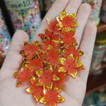 Matte acrylic flower beads with gold borders