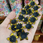 Matte acrylic flower beads with gold borders