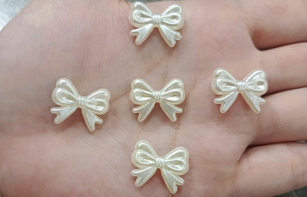 White bow beads