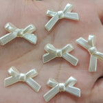 White bow beads